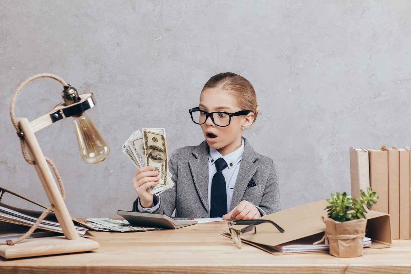 shocked kid with money