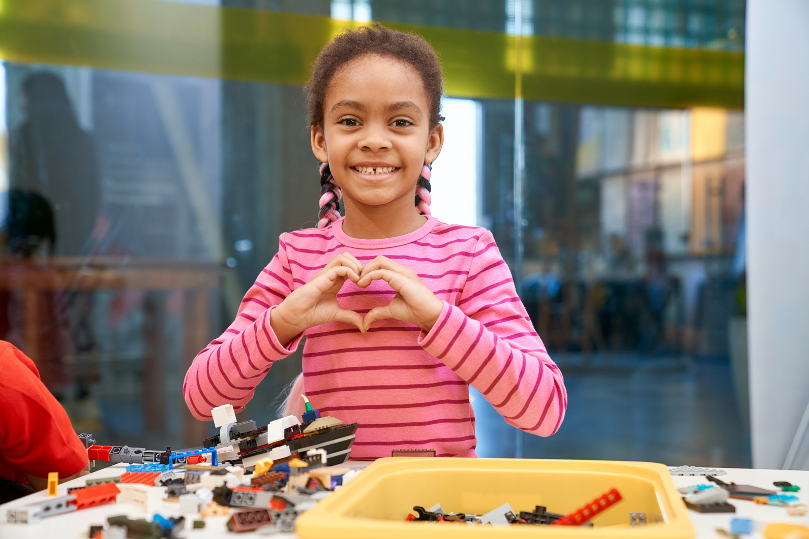 Girl Child Showing Heart Gesture.