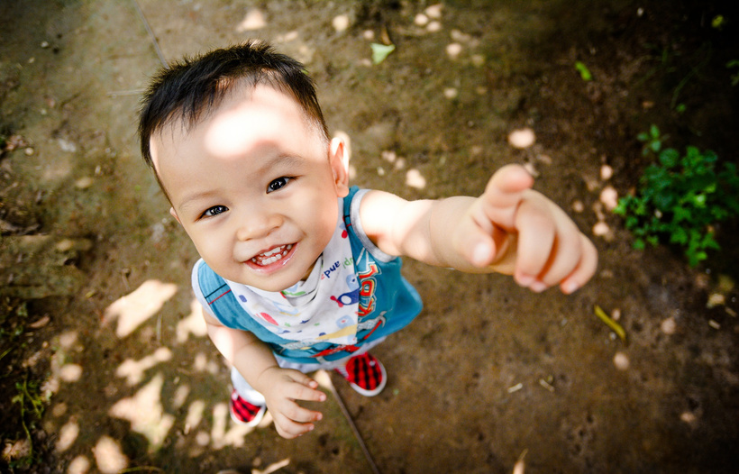 Smiling Kid Pointing at Camera