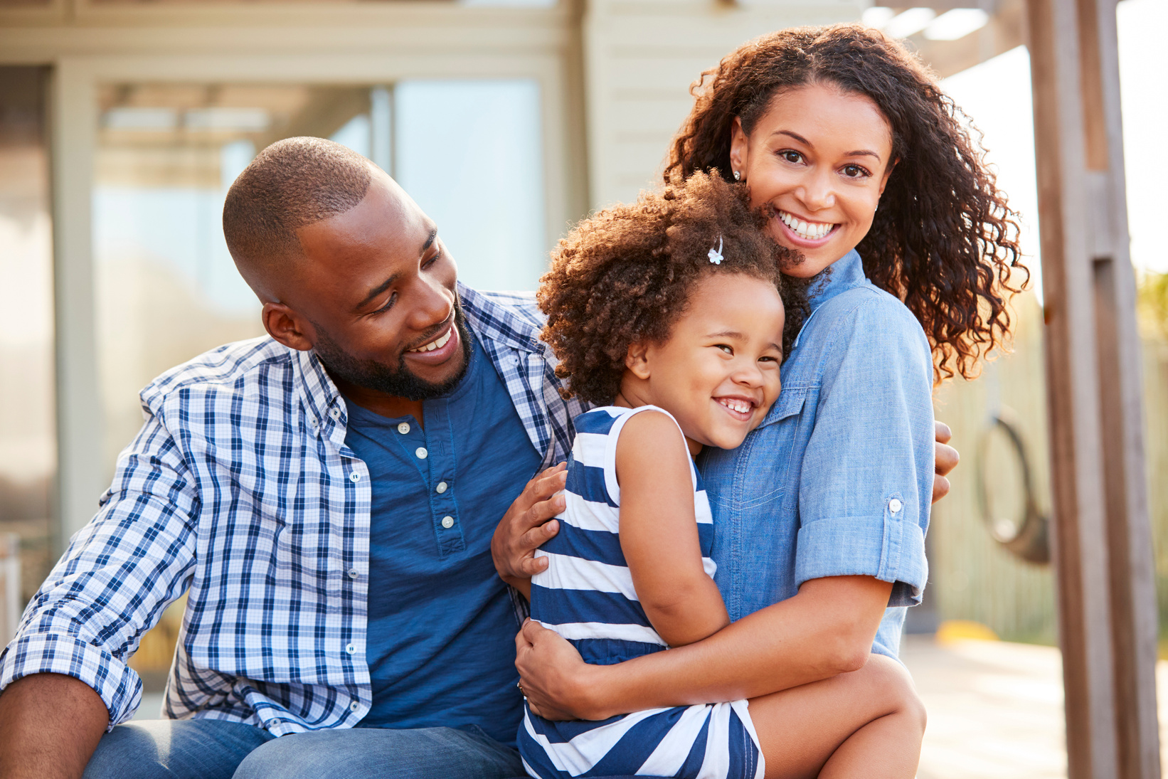 Family Embracing Outdoors 