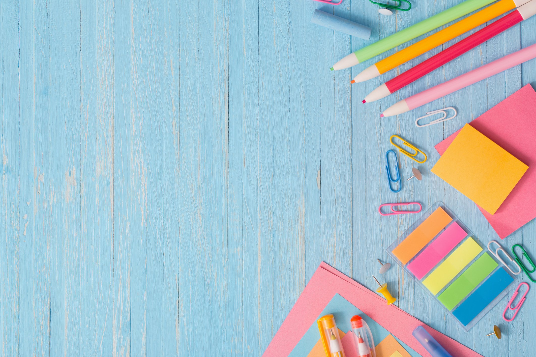 school supplies on  blue wooden background