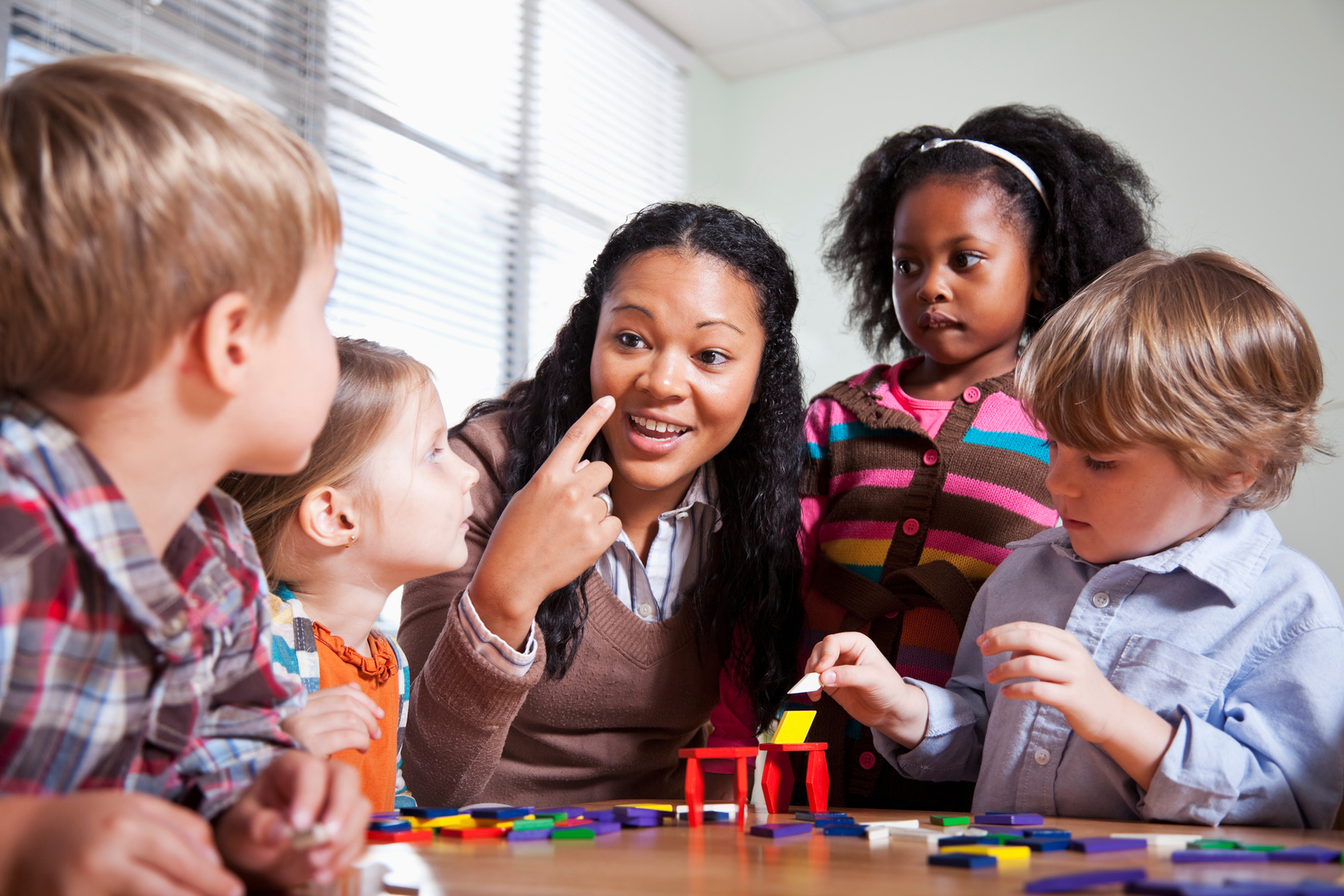 Preschool children in classroom with teacher