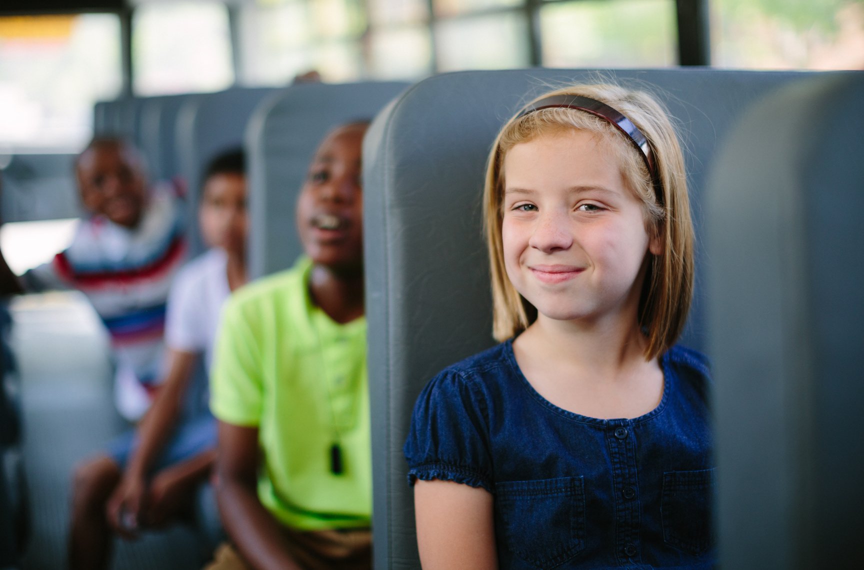 kids sitting on school bus