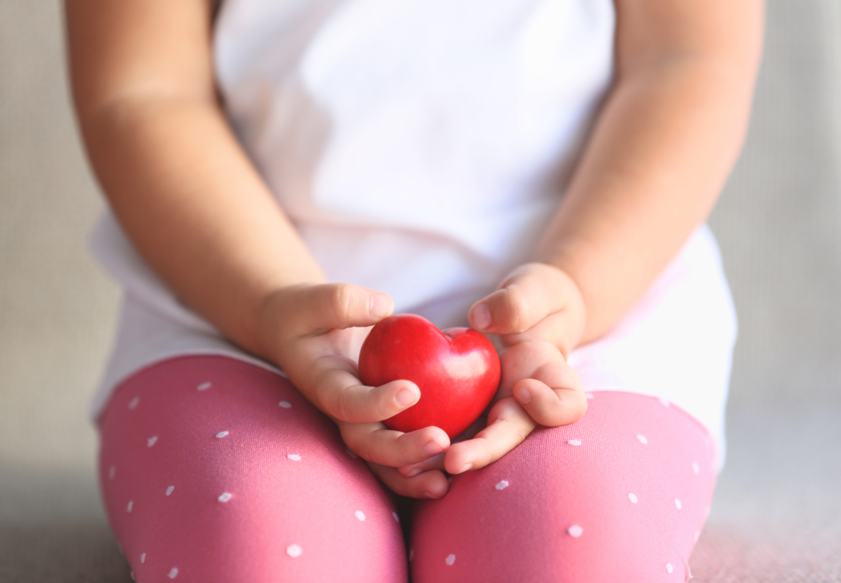 Child Holding Small Red Heart